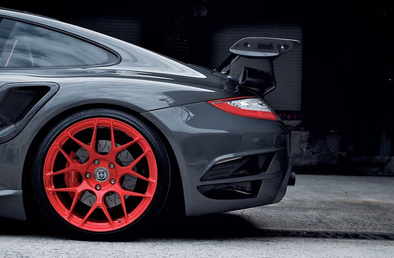 Gray Sports Car — Dramatic, Photograph, Red Wheels, Rear Wing