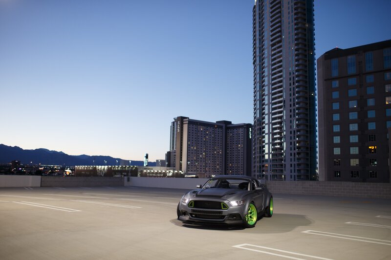 Gray Sports Car — Dramatic, Sunset, Photograph, Skyscrapers