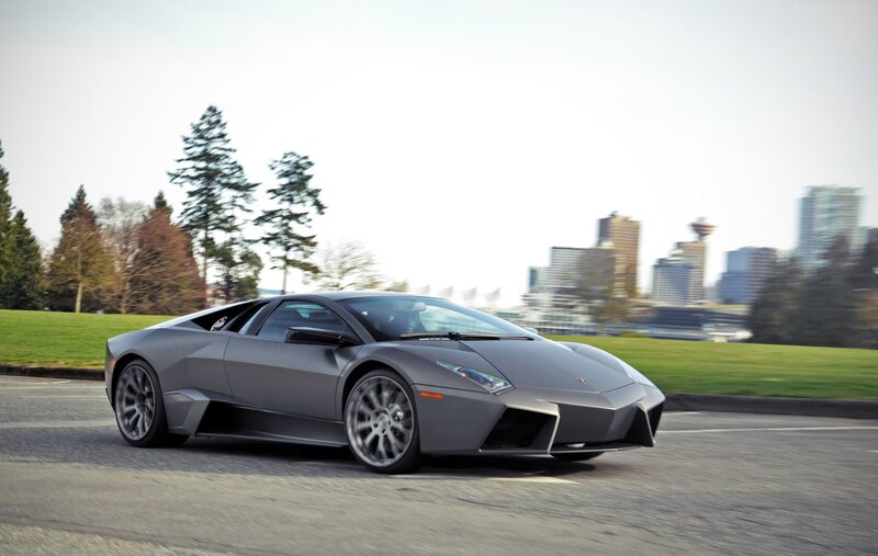 Gray Sports Car — Dynamic, Afternoon, Photograph, City Skyline, Trees