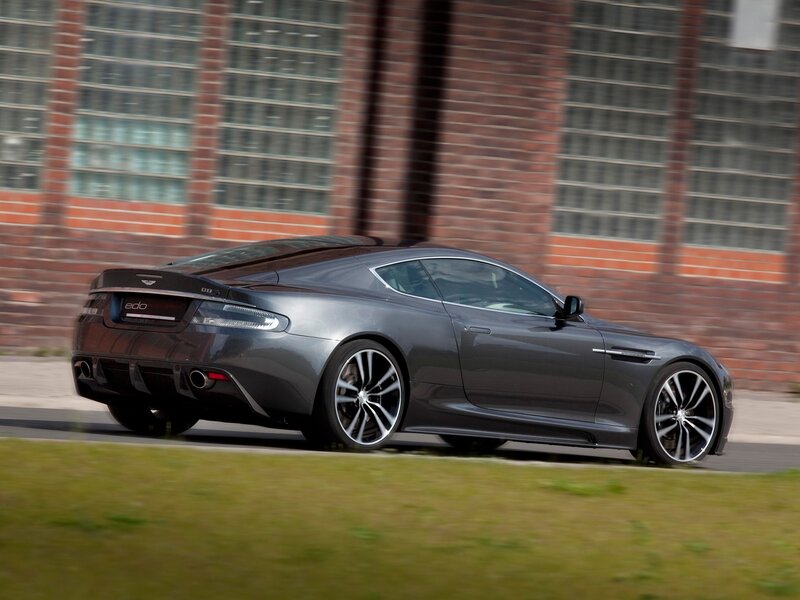 Gray Sports Car — Dynamic, Photograph, Brick Building, Grass