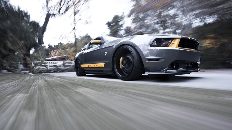 gray sports car in motion