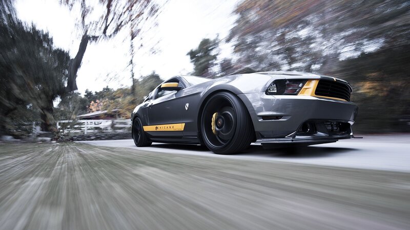 gray sports car in motion