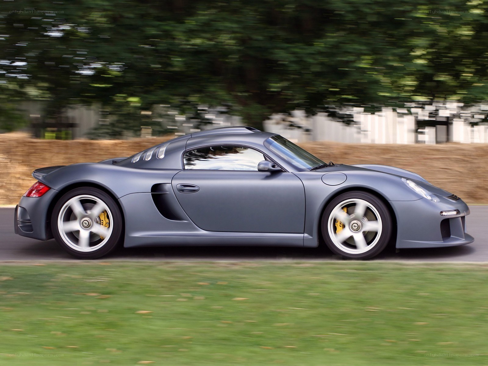 gray sports car in motion