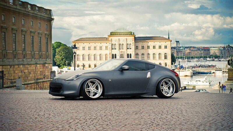 Gray sports car on cobblestones