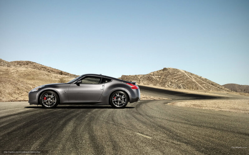 Gray sports car on desert road