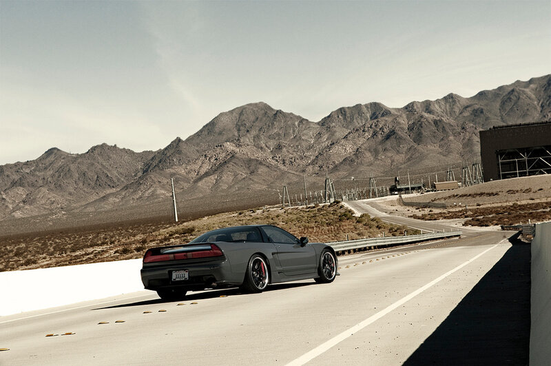 gray sports car on desert road