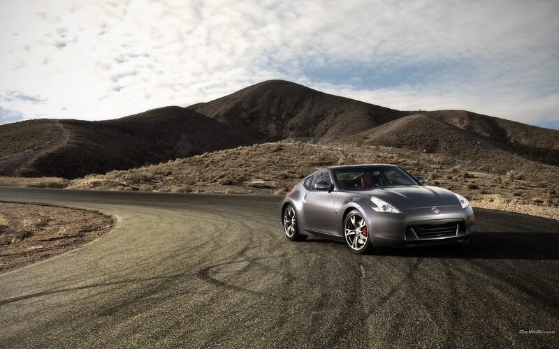 Gray sports car on desert road