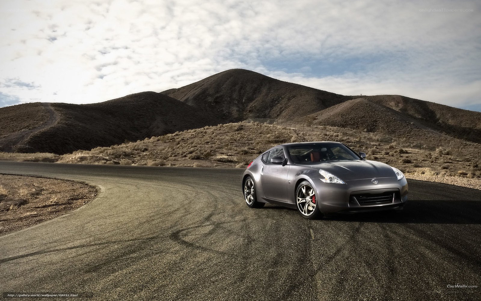 Gray sports car on desert road
