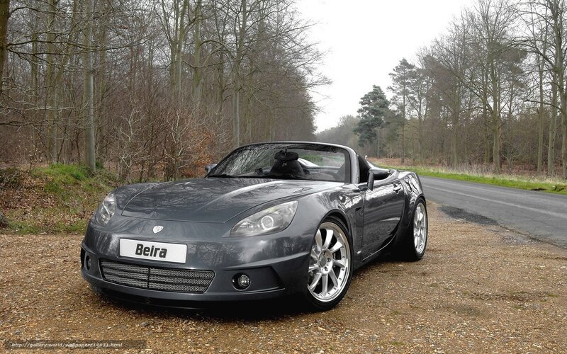 Gray sports car on gravel