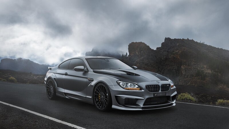 gray sports car on mountain road
