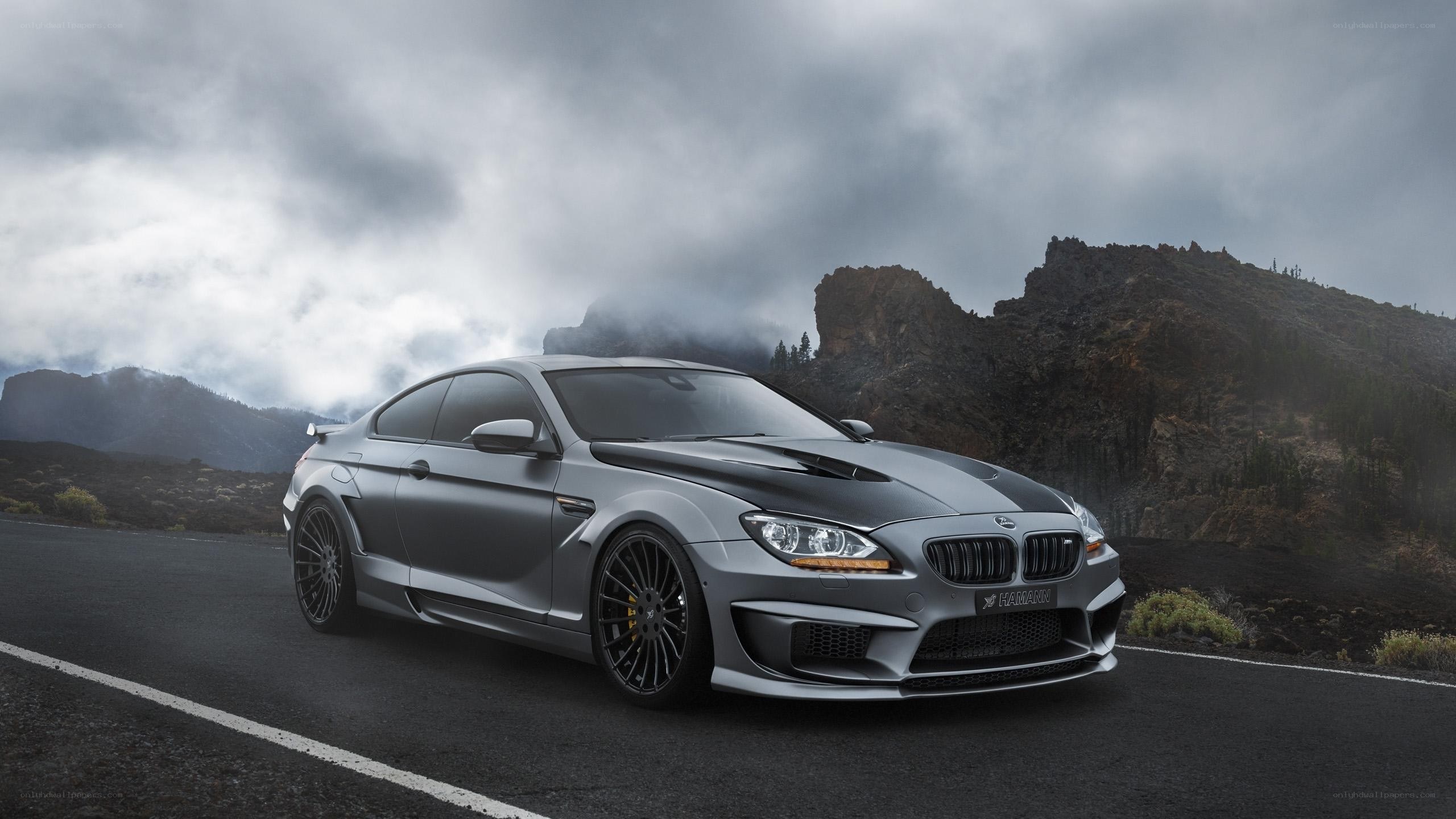 gray sports car on mountain road