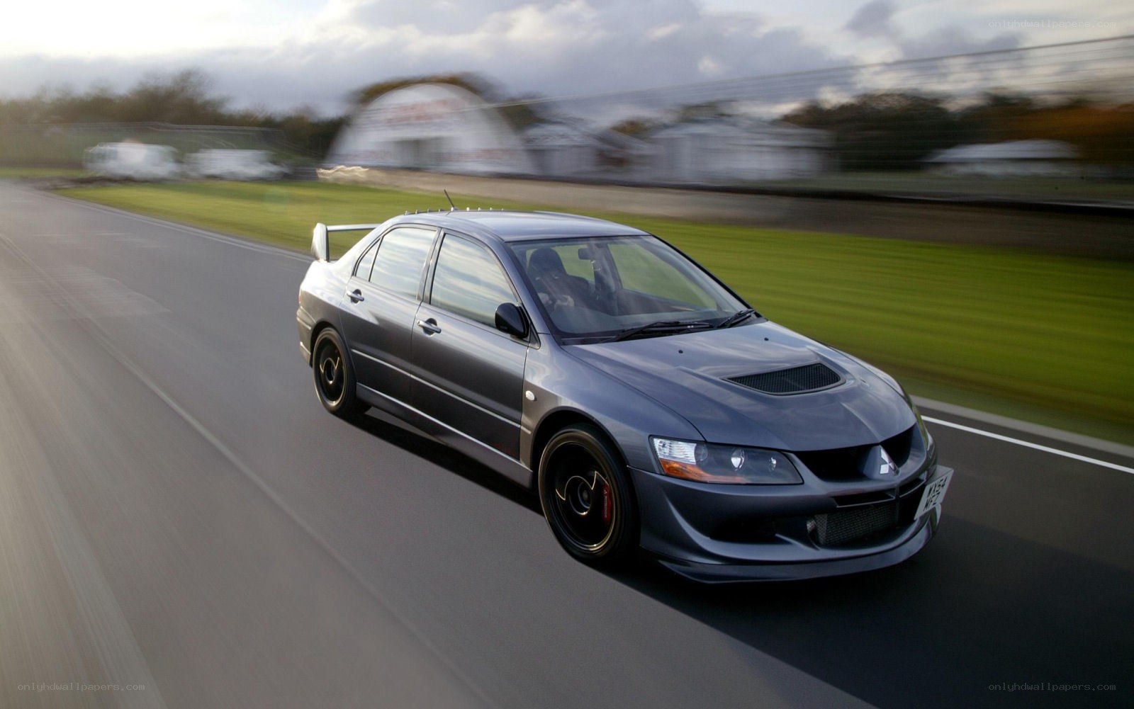 gray sports car on racetrack