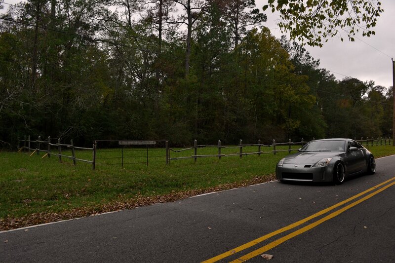 gray sports car on rural road