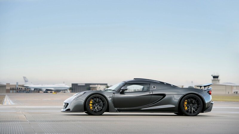 gray sports car on tarmac