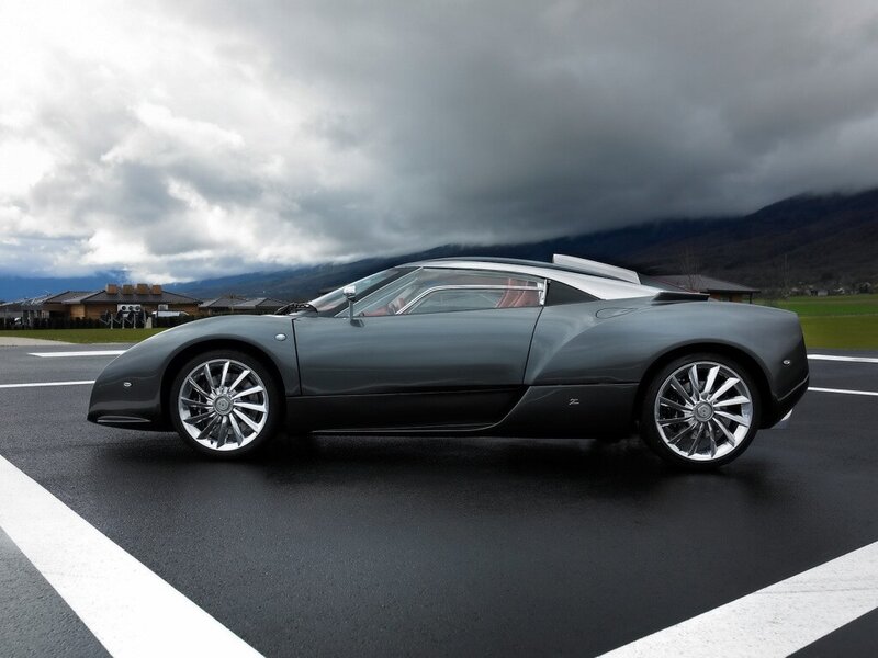 gray sports car on tarmac
