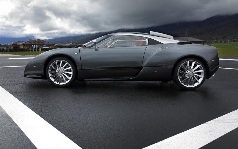 gray sports car on tarmac