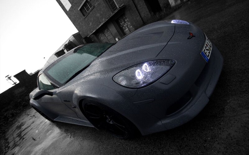 gray sports car on wet pavement