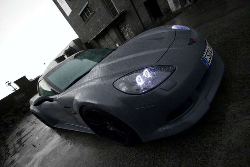 gray sports car on wet pavement