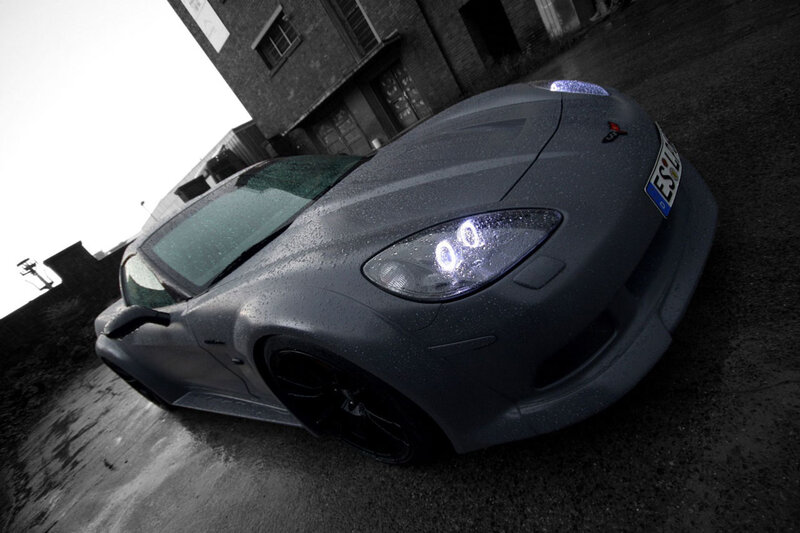 gray sports car on wet pavement
