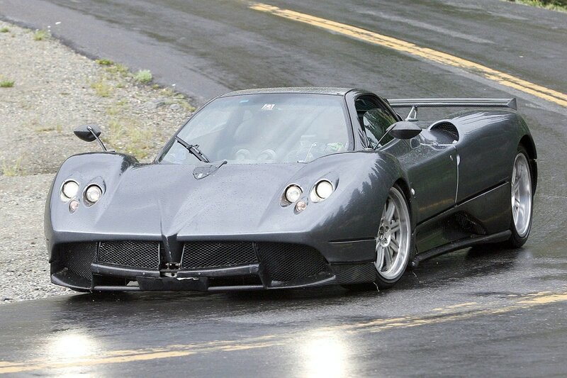 gray sports car on wet road