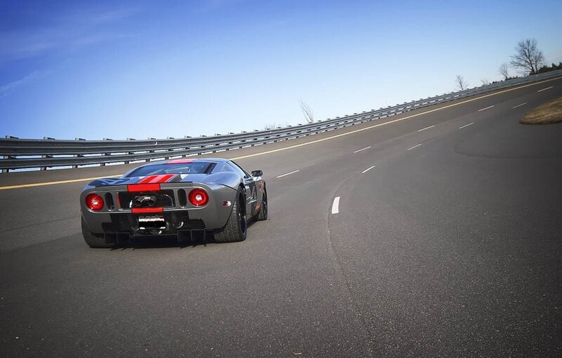 gray sports car on winding road