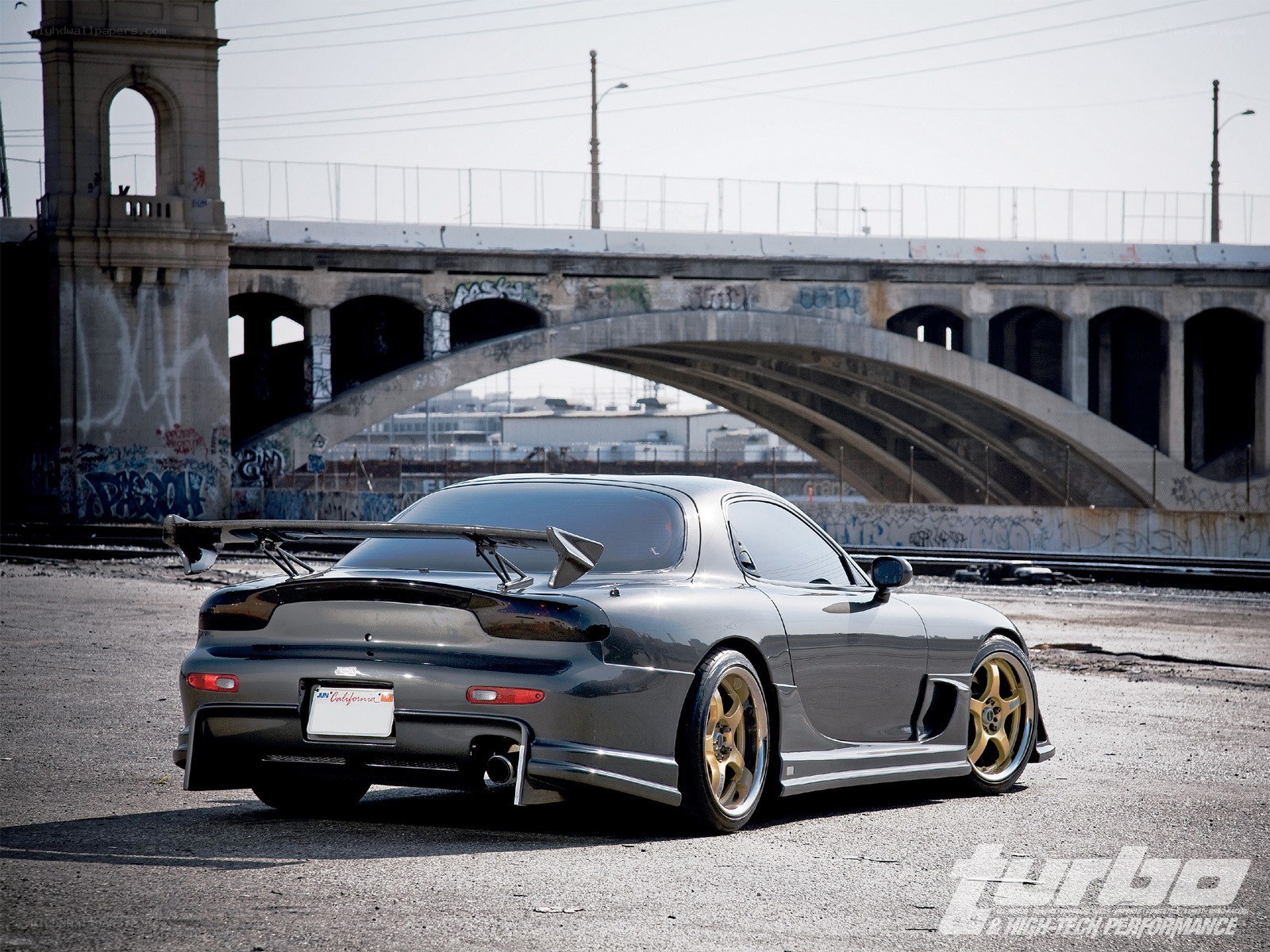 gray sports car under bridge