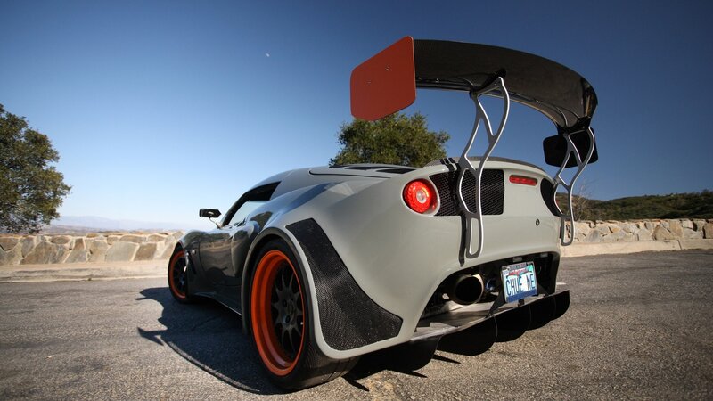 gray sports car with large rear wing