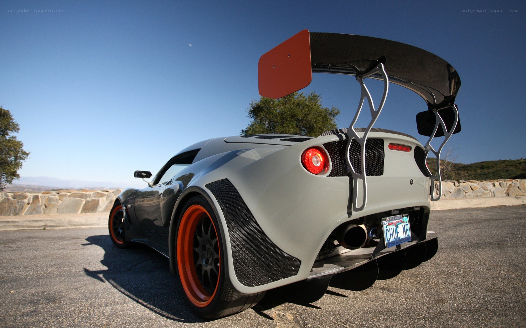 gray sports car with large wing