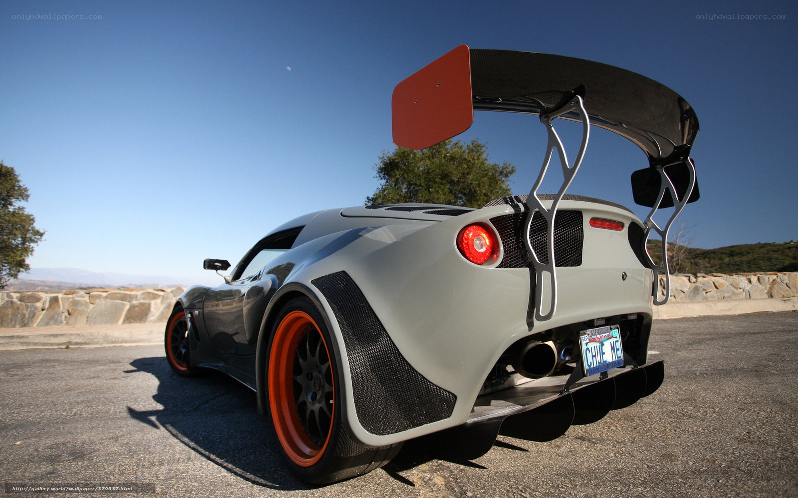 gray sports car with large wing