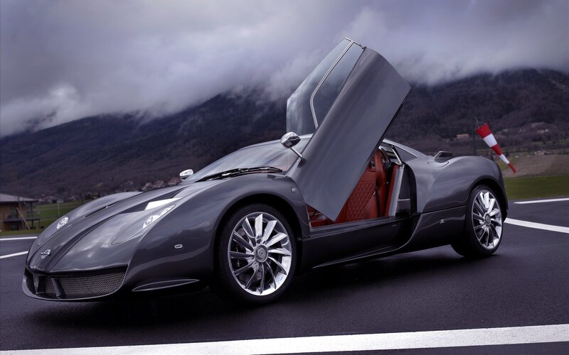 gray sports car with open door