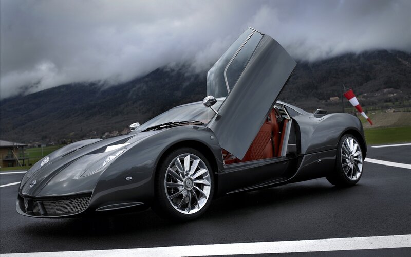 Gray sports car with open door