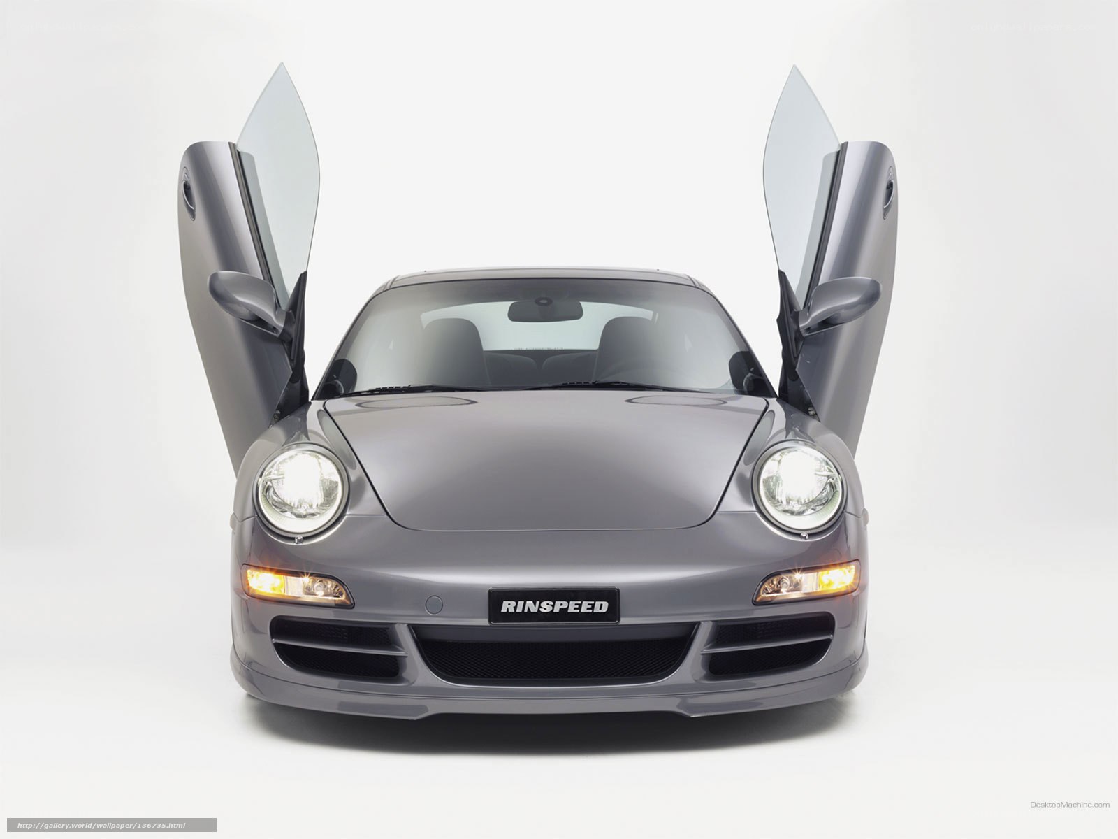 gray sports car with open doors