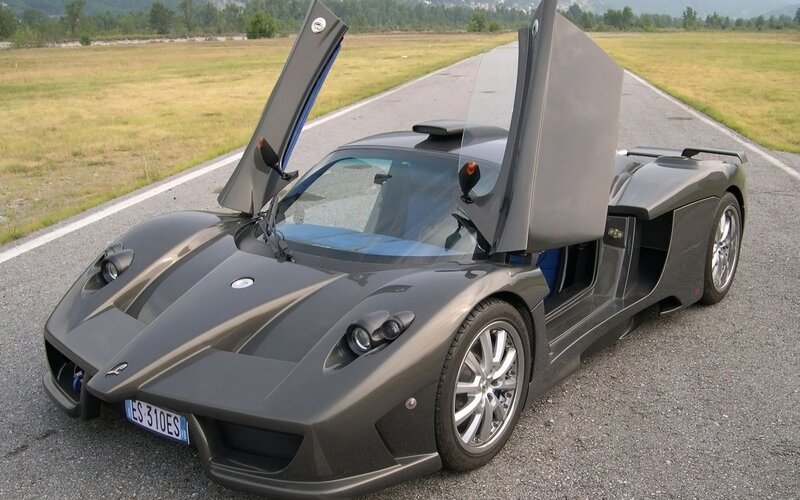 gray sports car with open doors