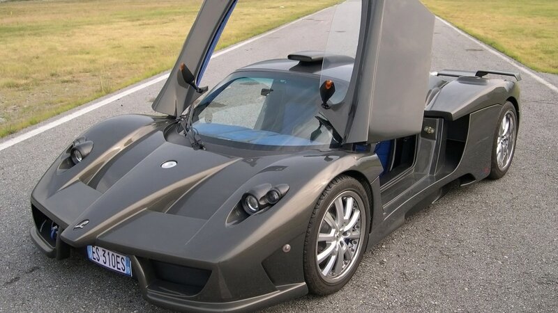 gray sports car with open doors