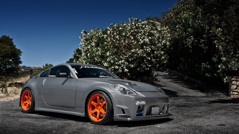 gray sports car with orange wheels