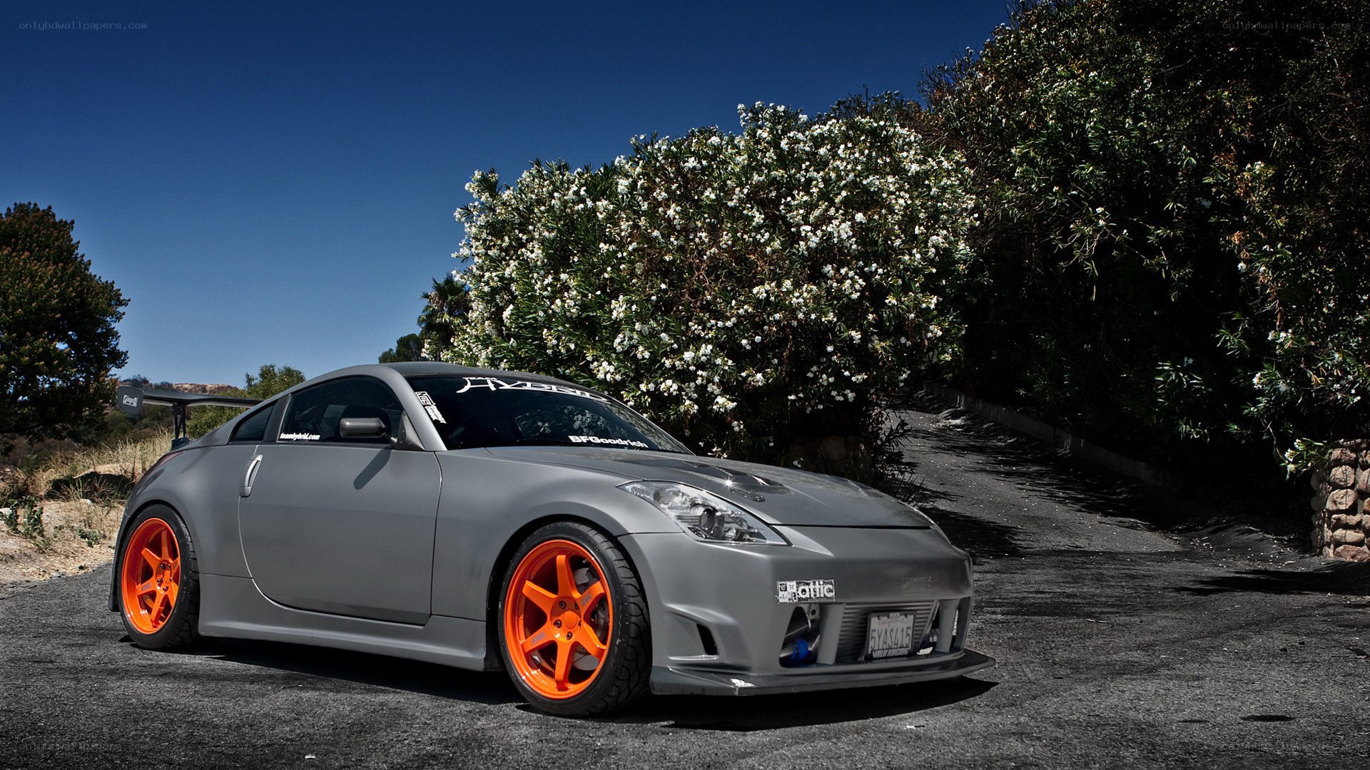 gray sports car with orange wheels