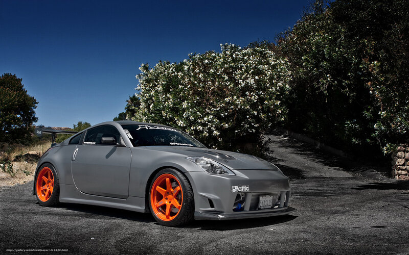 gray sports car with orange wheels