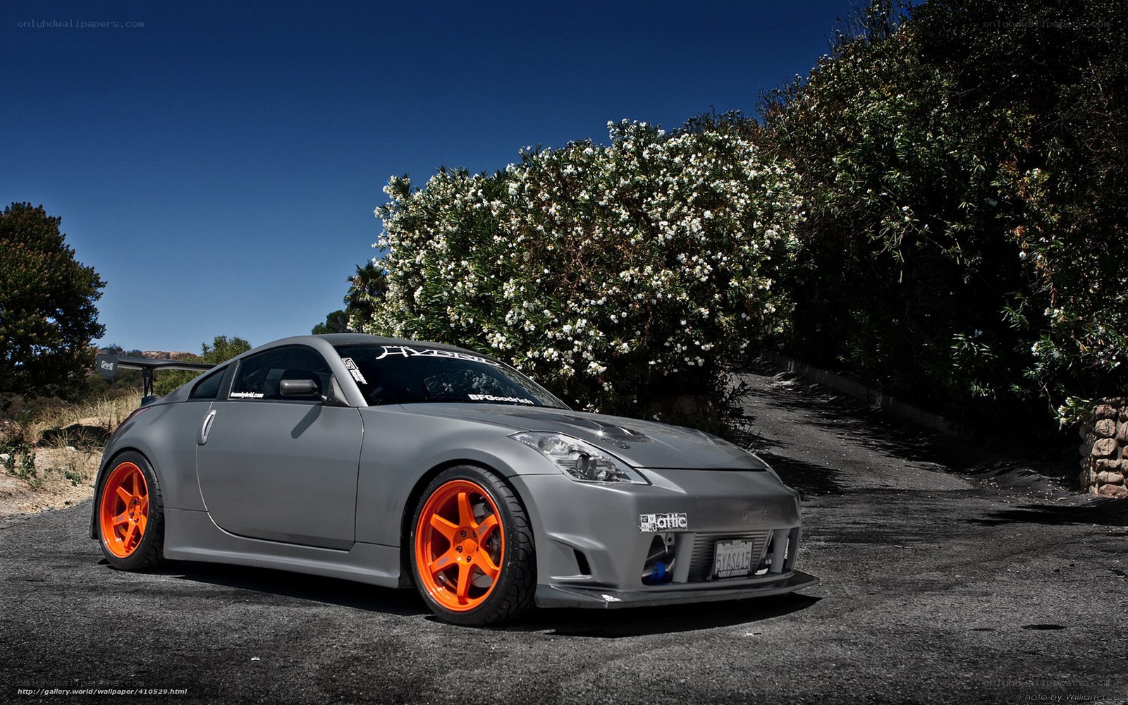 gray sports car with orange wheels