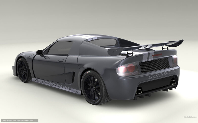 gray sports car with rear wing