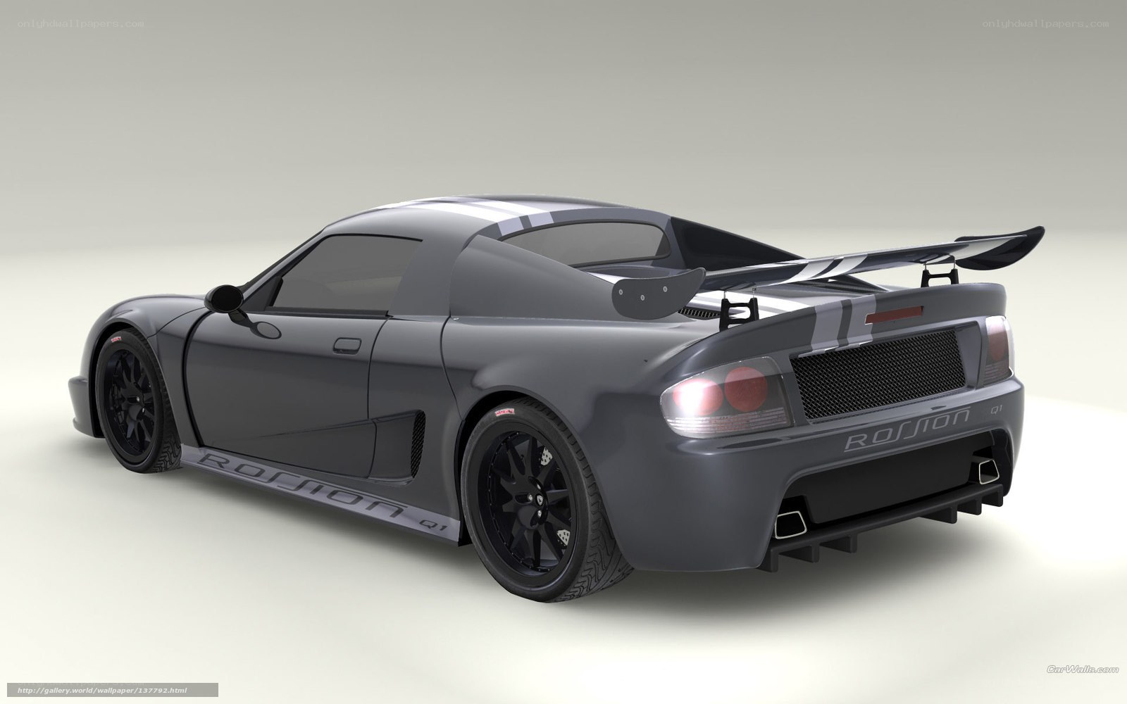 gray sports car with rear wing