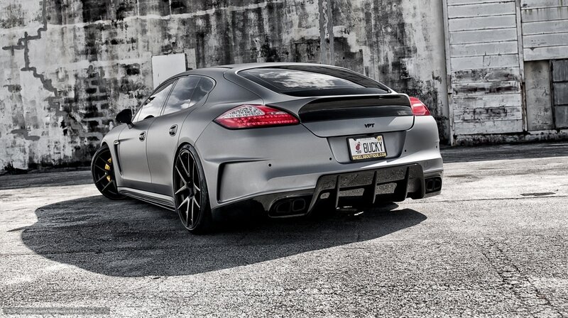 gray sports sedan in urban setting