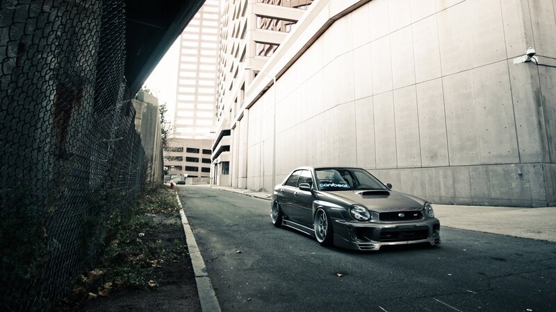 gray subaru in urban alley