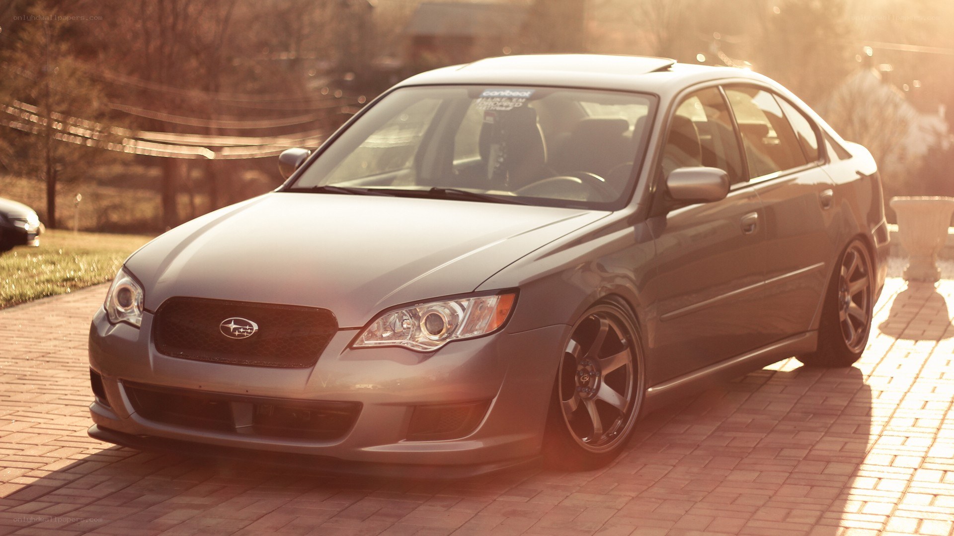gray subaru sedan on driveway