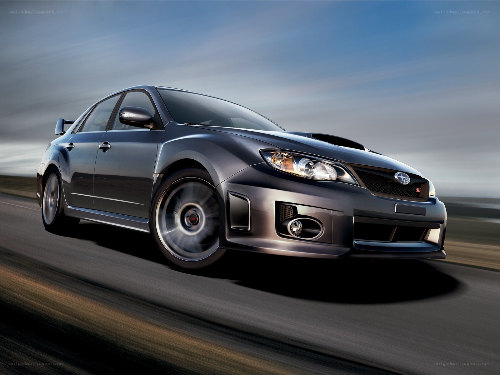 gray subaru wrx sti in motion