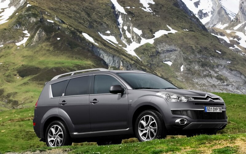Gray SUV in mountain landscape