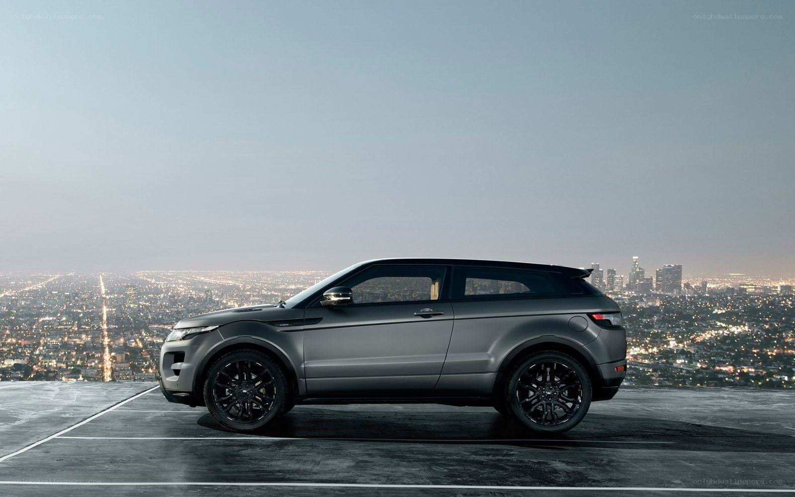 gray suv on city overlook