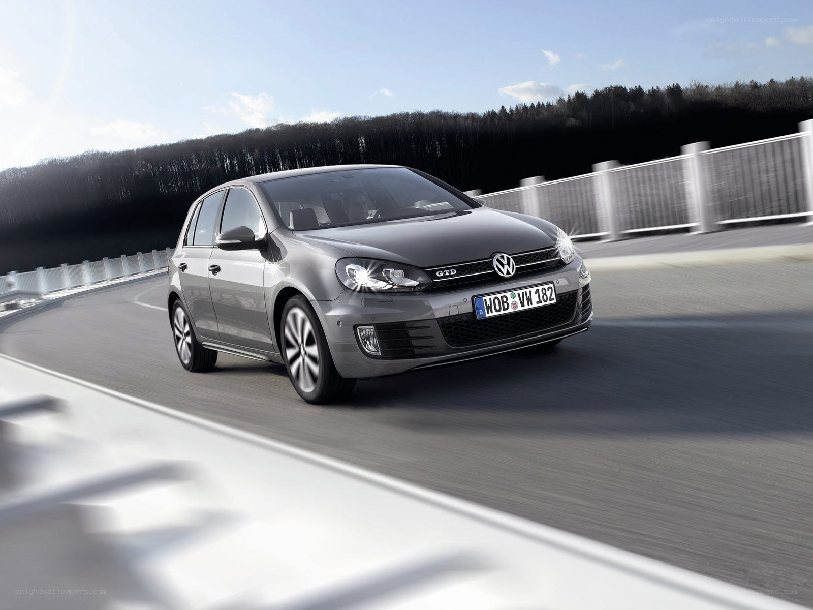 Gray Volkswagen Golf GTD in motion