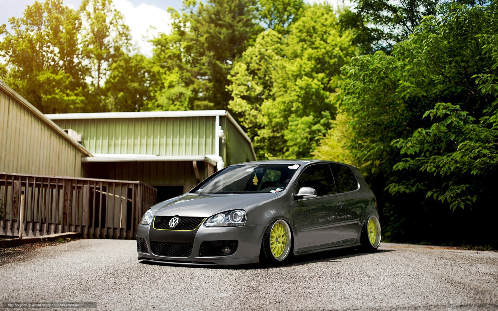 gray volkswagen golf with yellow wheels
