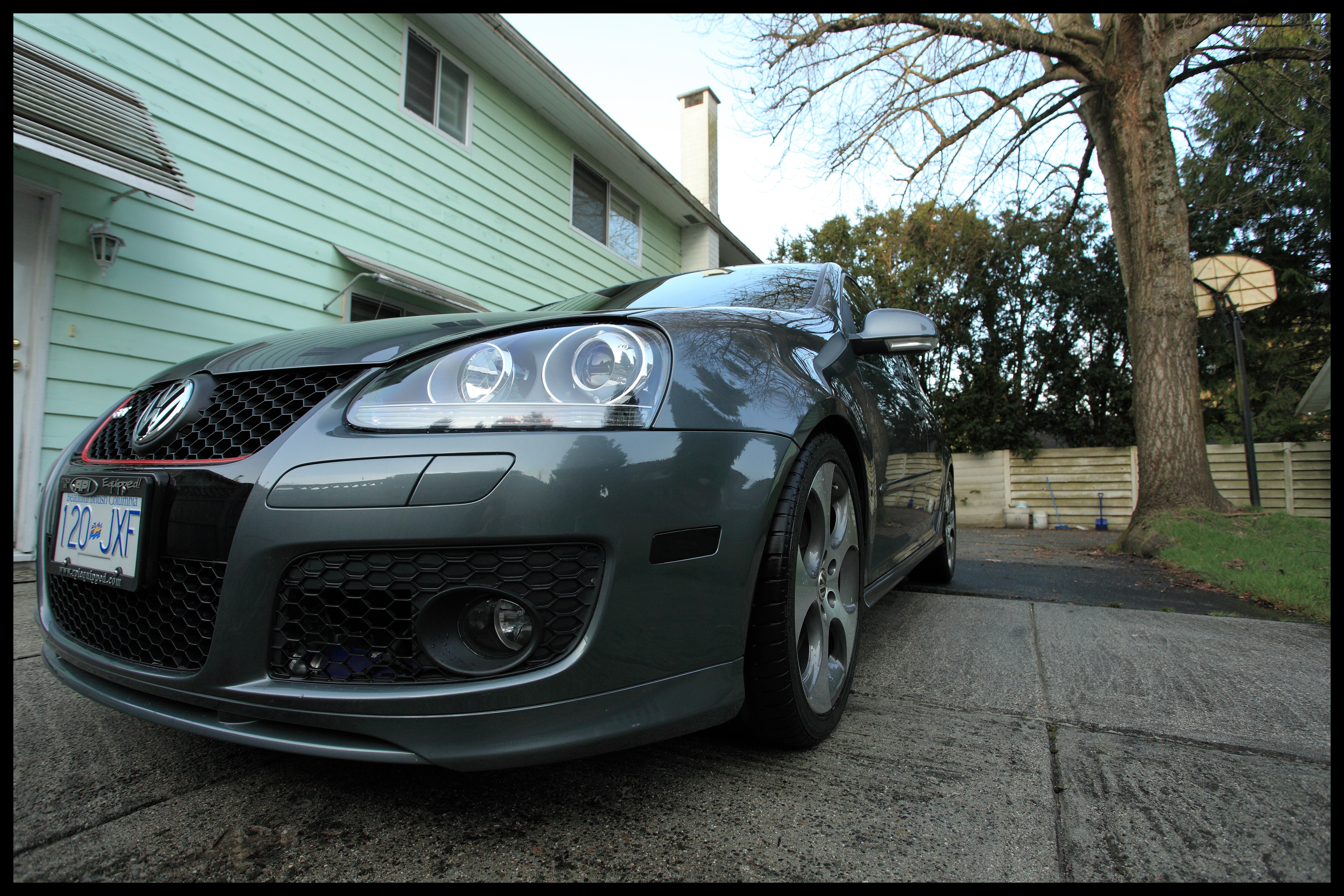 gray volkswagen in driveway
