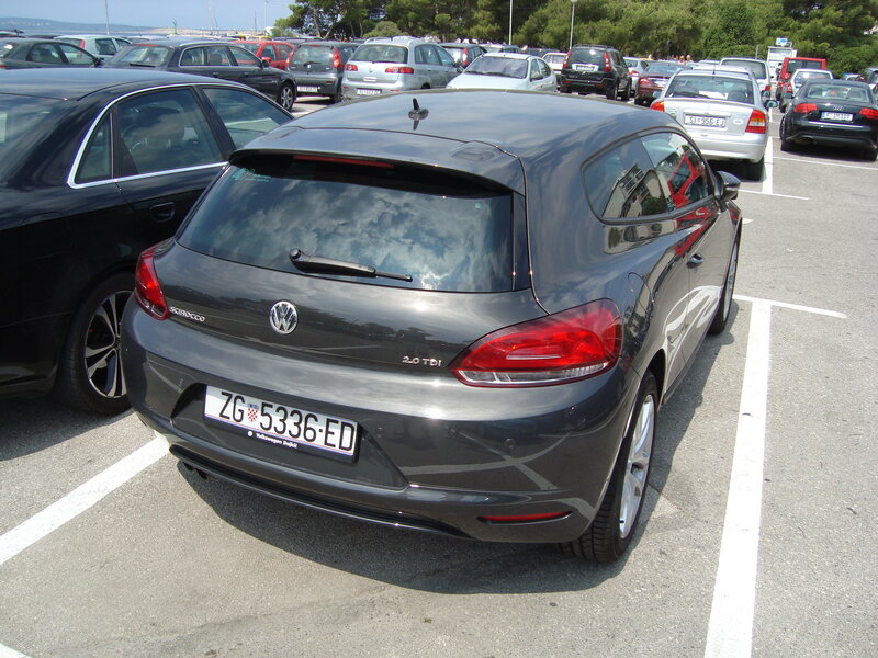 Gray Volkswagen Scirocco in parking lot